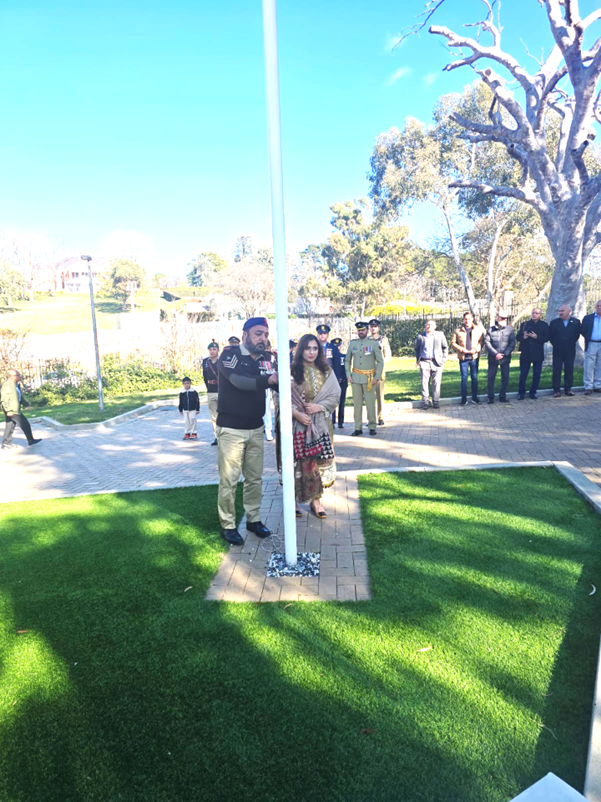 A person and person standing next to a white pole

AI-generated content may be incorrect.