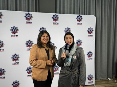 Two women standing in front of a white backdrop

AI-generated content may be incorrect.