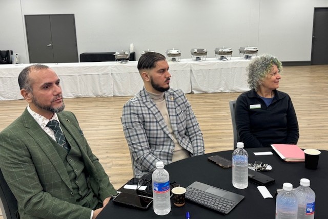 A group of people sitting at a round table

AI-generated content may be incorrect.