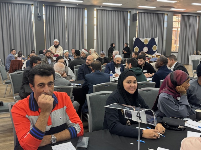 A group of people sitting at tables

AI-generated content may be incorrect.