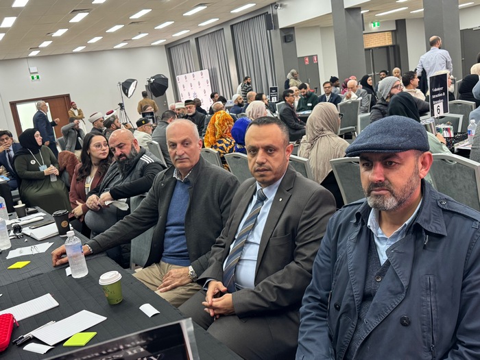 A group of people sitting in a room

AI-generated content may be incorrect.