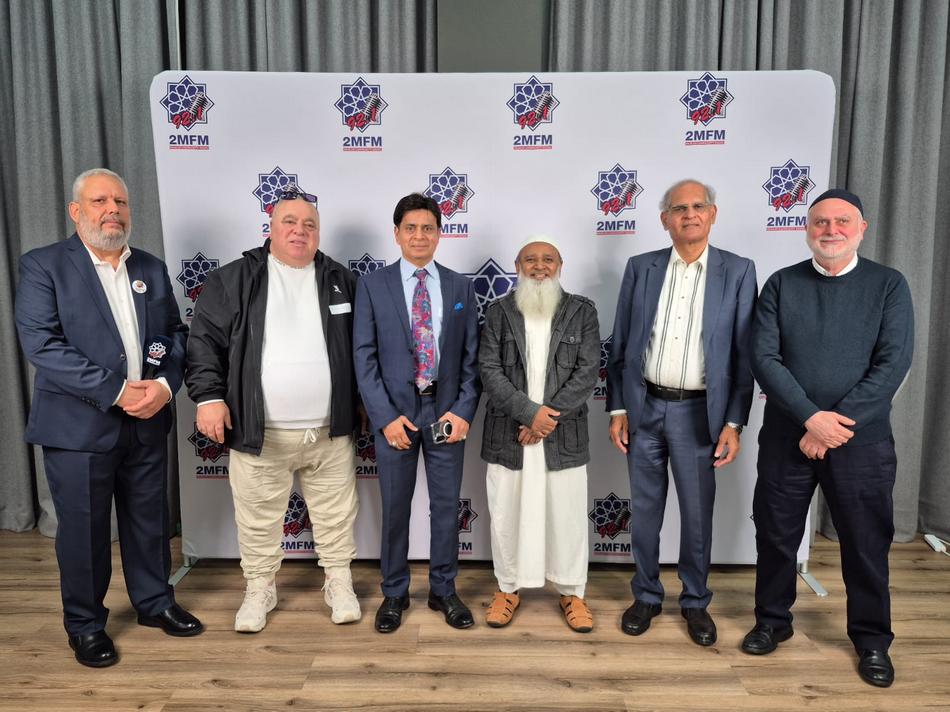 A group of men standing in front of a white backdrop

AI-generated content may be incorrect.
