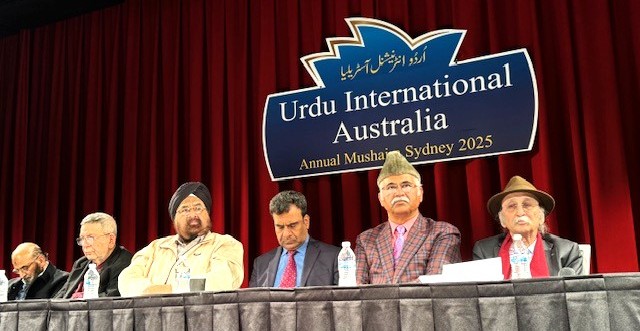 A group of men sitting at a podium

AI-generated content may be incorrect.