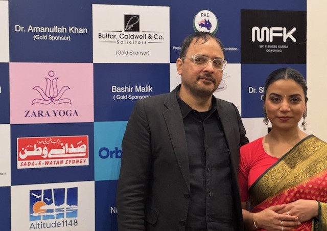 A person and person standing in front of a wall with logos

AI-generated content may be incorrect.