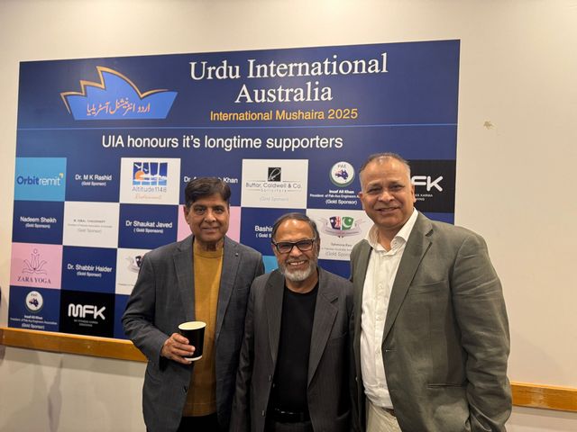 A group of men standing in front of a sign

AI-generated content may be incorrect.