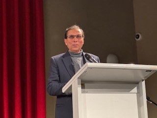 A person standing at a podium

AI-generated content may be incorrect.