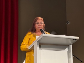 A person standing at a podium

AI-generated content may be incorrect.