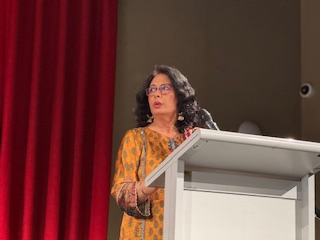 A person standing at a podium

AI-generated content may be incorrect.