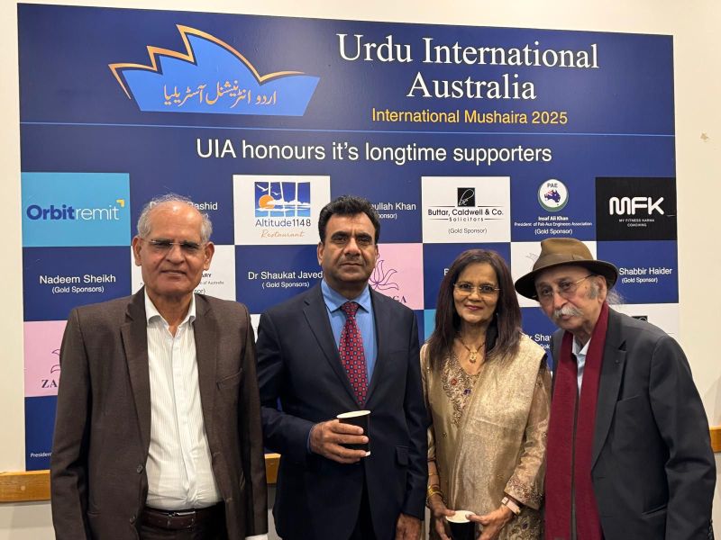 A group of people standing in front of a sign

AI-generated content may be incorrect.