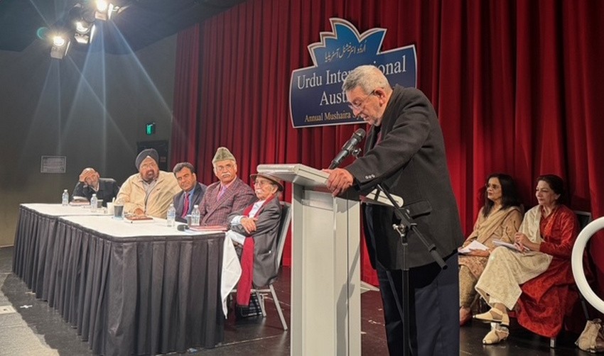 A person standing at a podium with a microphone

AI-generated content may be incorrect.