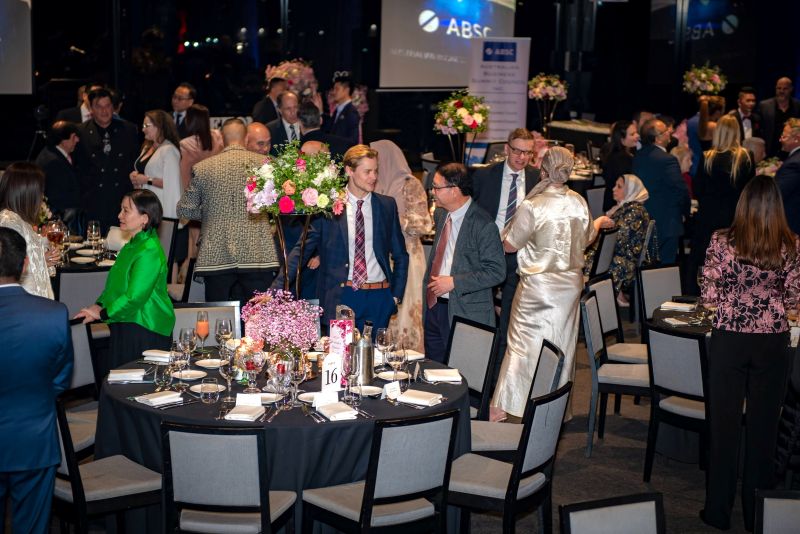 A group of people at a formal event

AI-generated content may be incorrect.
