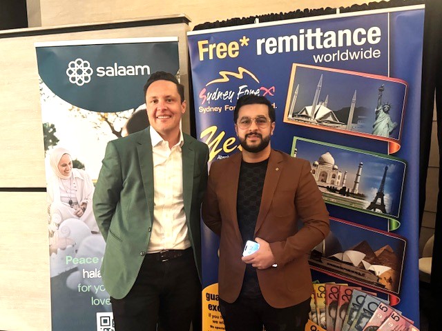 Two men standing in front of a banner

AI-generated content may be incorrect.