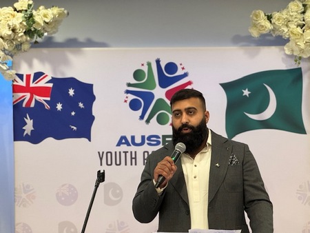 A person standing in front of a microphone

AI-generated content may be incorrect.