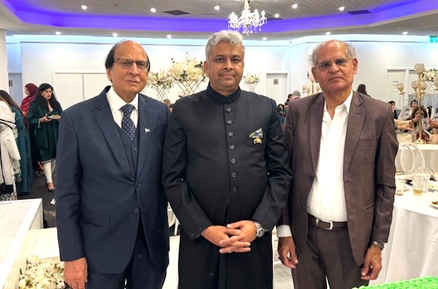 A group of men standing together

AI-generated content may be incorrect.