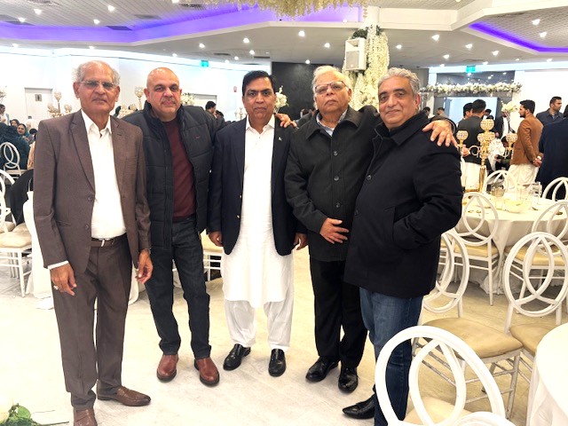 A group of men standing together

AI-generated content may be incorrect.