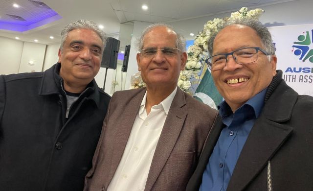 A group of men smiling for a photo

AI-generated content may be incorrect.