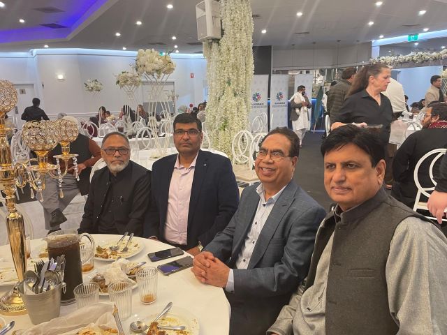 A group of men sitting at a table

AI-generated content may be incorrect.