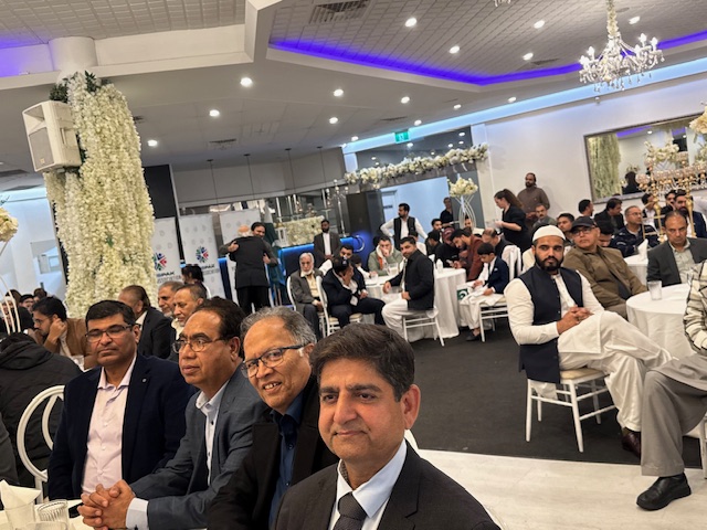 A group of men sitting in a room

AI-generated content may be incorrect.