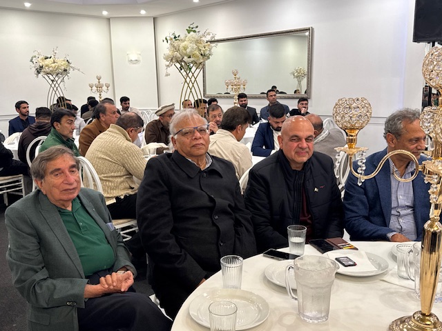 A group of people sitting at a table

AI-generated content may be incorrect.