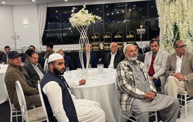 A group of men sitting at a table

AI-generated content may be incorrect.