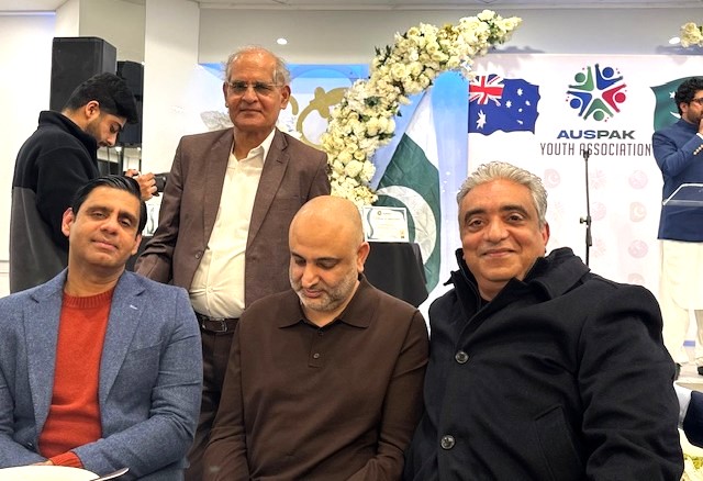 A group of men standing together

AI-generated content may be incorrect.