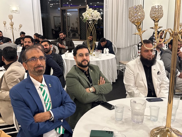 A group of men sitting at a table

AI-generated content may be incorrect.