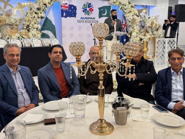 A group of men sitting at a table

AI-generated content may be incorrect.