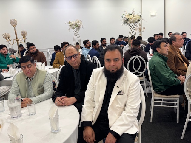 A group of men sitting at tables

AI-generated content may be incorrect.