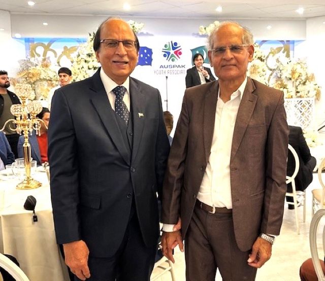 Two men standing together in a room

AI-generated content may be incorrect.