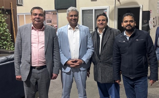 A group of men standing together

AI-generated content may be incorrect.