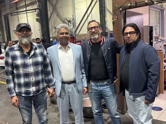 A group of men standing together

AI-generated content may be incorrect.