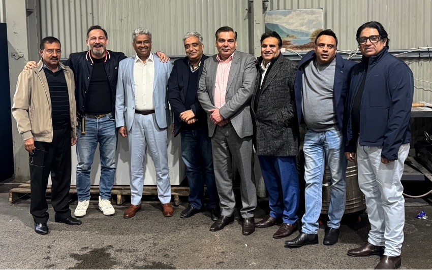 A group of men standing together

AI-generated content may be incorrect.