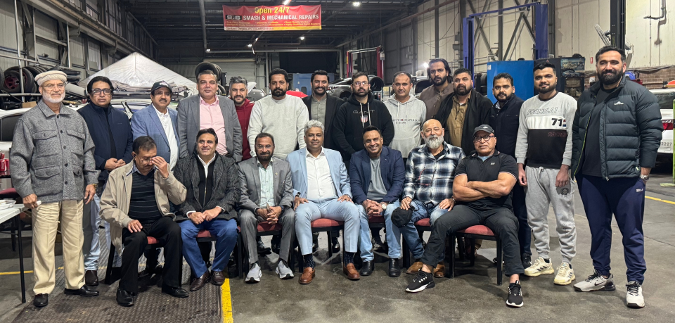 A group of men posing for a photo

AI-generated content may be incorrect.