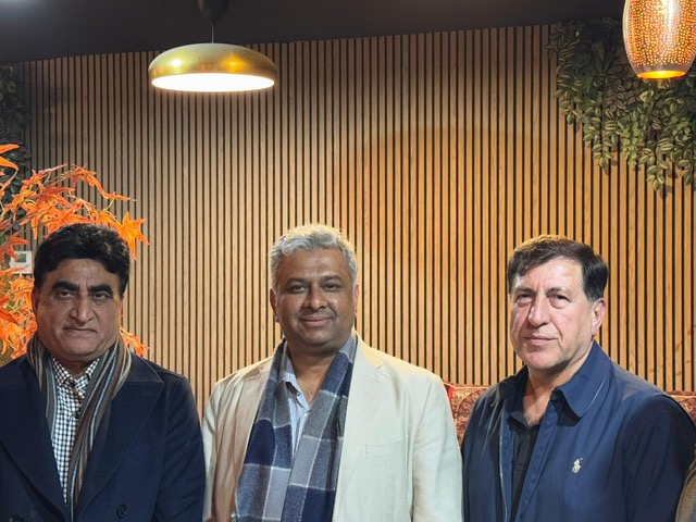 A group of men standing in front of a wood paneled wall

AI-generated content may be incorrect.