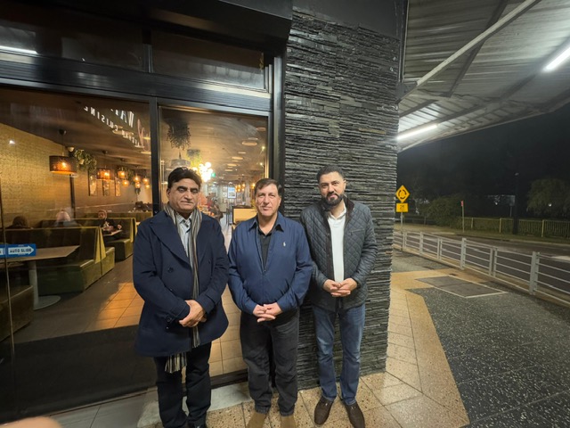 A group of men standing outside a building

AI-generated content may be incorrect.