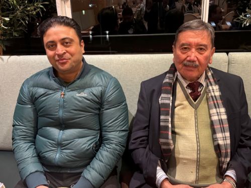 Two men sitting on a bench

AI-generated content may be incorrect.