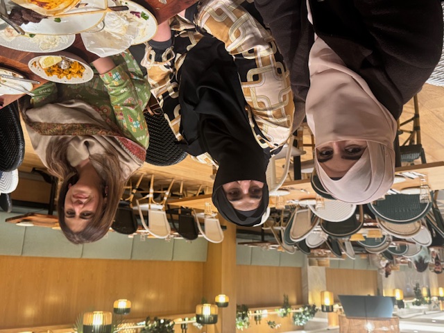 A group of women sitting at a table

AI-generated content may be incorrect.