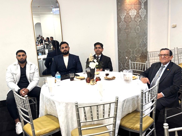 A group of men sitting at a round table

AI-generated content may be incorrect.