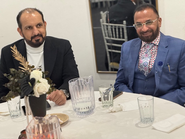 Two men sitting at a table

AI-generated content may be incorrect.