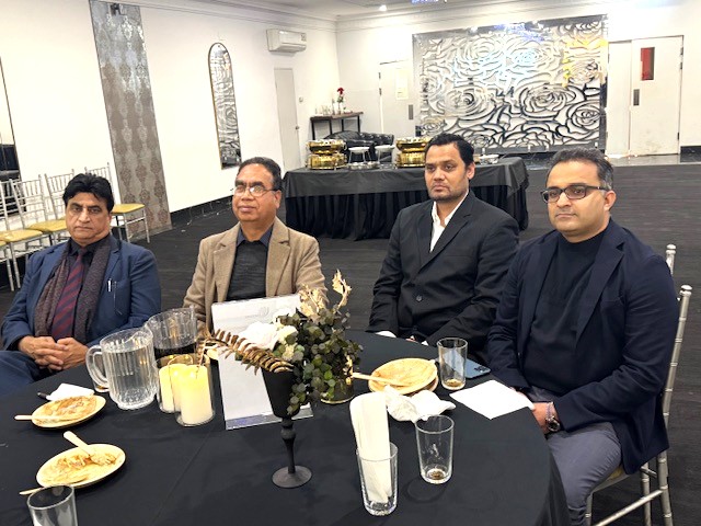 A group of men sitting at a table

AI-generated content may be incorrect.