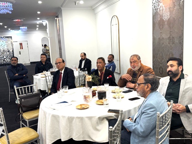 A group of people sitting around a round table

AI-generated content may be incorrect.