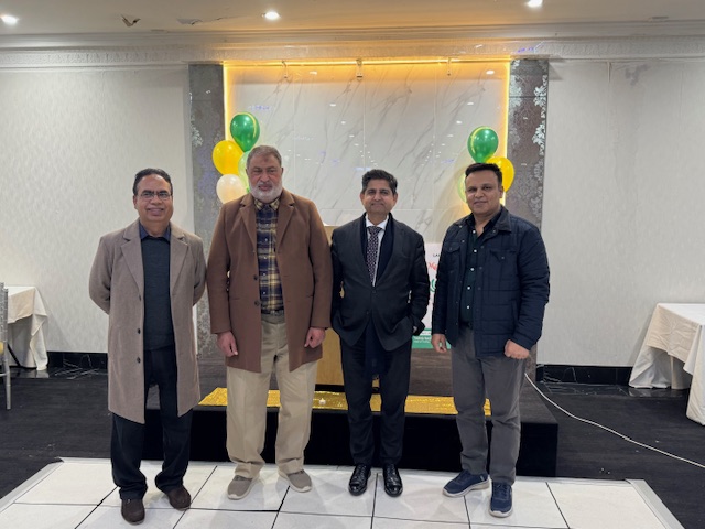 A group of men standing in front of a stage

AI-generated content may be incorrect.