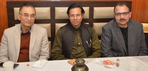 A group of men sitting at a table

AI-generated content may be incorrect.