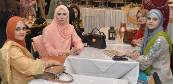 A person in a pink dress sitting at a table

AI-generated content may be incorrect.