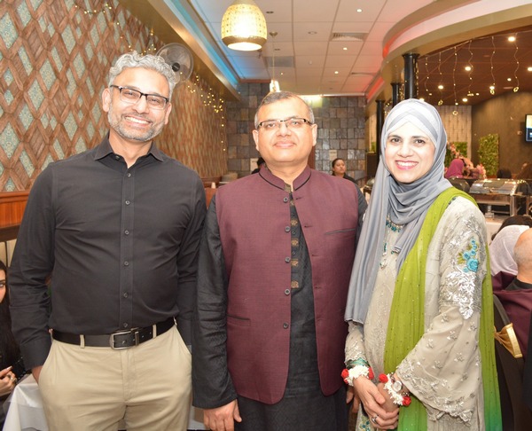 A group of people standing together

AI-generated content may be incorrect.