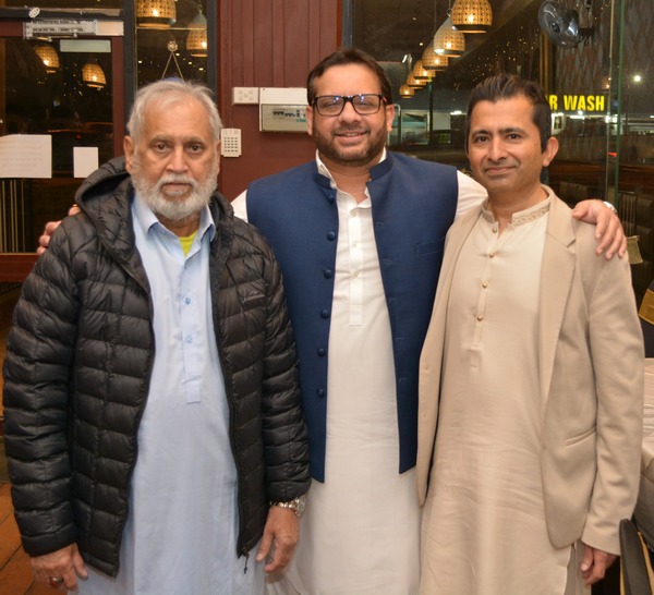 A group of men standing together

AI-generated content may be incorrect.