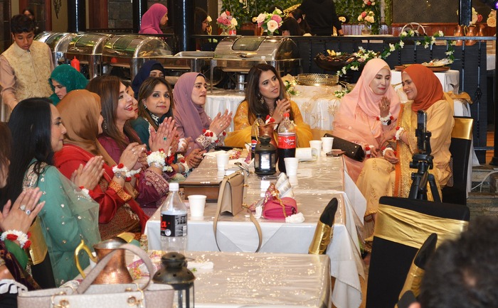 A group of women sitting at tables

AI-generated content may be incorrect.