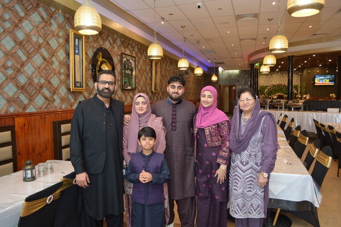 A group of people posing for a photo

AI-generated content may be incorrect.