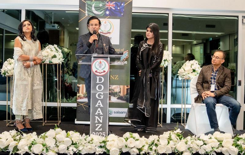 A person standing in front of a podium with a microphone

AI-generated content may be incorrect.