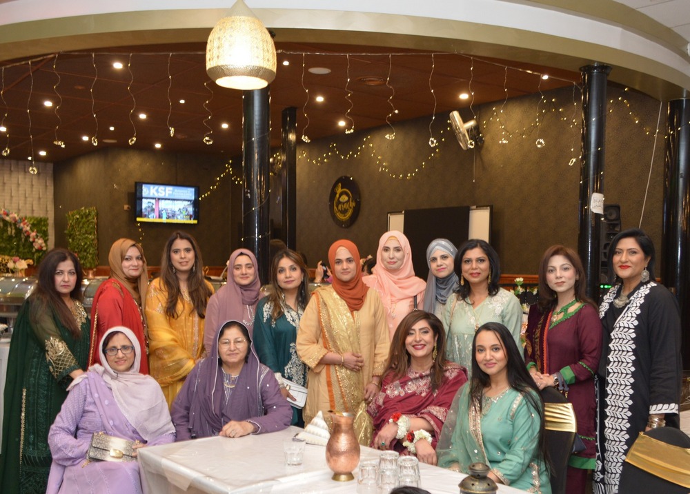 A group of women posing for a photo

AI-generated content may be incorrect.